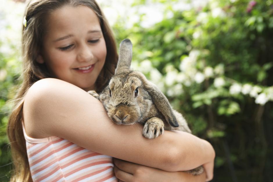 girl holding rabbit